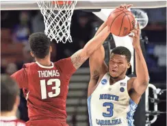  ?? BOB DONNAN, USA TODAY SPORTS ?? Kennedy Meeks, right, is North Carolina’s top rebounder with 9.3 per game.