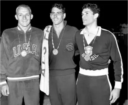  ?? ASSOCIATED PRESS ?? Mr. Larson (left) on the medal stand in Rome with John Devitt (center) and third-place winner Manuel Dos Santos after the 100-meter freestyle in the 1960 Olympics.