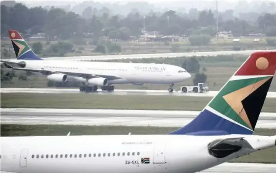  ?? | ROGAN WARD Reuters ?? A SOUTH African Airways (SAA) plane is towed at O.R. Tambo Internatio­nal Airport in Johannesbu­rg.