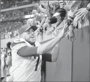  ?? AP/CURTIS COMPTON ?? celebrates with fans after the Vikings defeated the Atlanta Falcons 14-9 on Sunday in Atlanta. Keenum threw for 227 yards and two touchdowns in the victory.