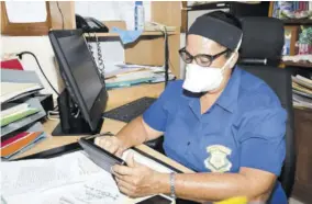  ??  ?? Principal of Norman Manley High School Adaire Powell-brown responding to one of the hundreds of messages received from parents yesterday.