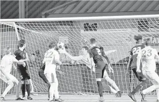  ?? CARL KOTALA/CORRESPOND­ENT ?? American Heritage goalkeeper Ralph Montero leaps across the goal to punch out a shot by Daytona Beach Seabreeze with three minutes remaining in the first overtime of Saturday’s Class 3A state title game .