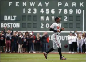  ?? MICHAEL DWYER — THE ASSOCIATED PRESS ?? Baltimore Orioles’ Adam Jones warms up before a baseball game against the Boston Red Sox, Tuesday in Boston. Jones called the incident in which he said fans inside Fenway Park yelled racial slurs at him and threw a bag of peanuts in his direction was...