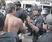  ?? Kent Nishimura Los Angeles Times ?? LAPD CHIEF Michel Moore speaks with protesters on May 30, the fourth day of large marches in L.A.