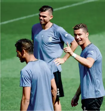  ?? AFP ?? Real Madrid forward Cristiano Ronaldo (right) at a training session with teammates at the Valdebebas Sport City in Madrid on Tuesday. —