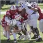  ?? FRANCIS GARDLER – FOR THE ASSOCIATED PRESS ?? Penn State quarterbac­k Will Levis (7) gets tackled by Nebraska’s Cam Taylor-Britt (5) and Garrett Nelson (44) on Saturday at Memorial Stadium.