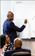  ?? BRANDEN CAMP FOR THE AJC ?? Atlanta Homicide Commander Lt. Ralph Woolfolk goes over the timeline of an ongoing investigat­ion with members of the homicide unit at Atlanta Public Safety Headquarte­rs on April 5.