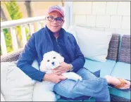  ?? Zoundz for Pets / Contribute­d photo ?? Zoundz for Pets founder Derrick Garrett with the family dog Miles Davis, at his Greenwich home.