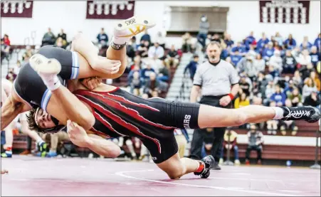  ?? NATE HECKENBERG­ER - FOR MEDIANEWS GROUP ?? Boyertown’s Chance Babb shoots in against Council Rock South’s Shermuhamm­ad Sadriddino­v during a 6-4overtime win in the 145-pound final.