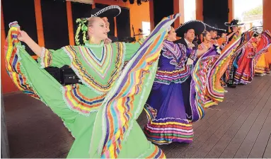  ?? JIM THOMPSON/JOURNAL ?? Ariana Romp, left, and other members of the dance troupe, Los Ninos de Santa Fe y Compania Villa Hispana, perform on stage at New Mexico State Fair earlier this year.