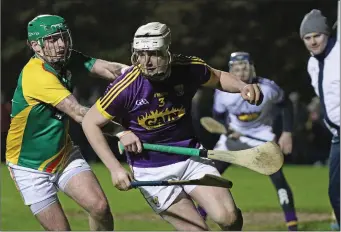  ??  ?? Full-back Liam Ryan is close to his own endline as Carlow’s Craig Wall applies pressure.