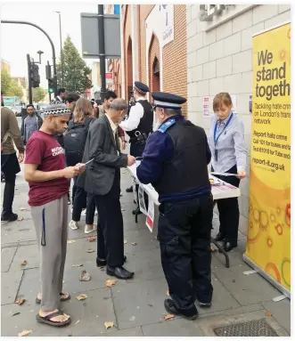  ??  ?? Police officers and anti-hate crime campaigner­s visited London communitie­s and transport infrastruc­ture on Monday to raise awareness and urge better reporting of hate crimes. (Photo courtesy: Transport for London (TfL)