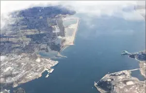  ?? CAPE BRETON POST PHOTO ?? At centre left in the above photo is the greenfield site where the proposed Novaporte container terminal and Novazone logistic park are expected to go in Point Edward. A delegation including CBRM Mayor Cecil Clarke, provincial Business Minister Geoff...