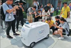  ?? FANG DONGXU / FOR CHINA DAILY ?? A 5G-enabled Suning delivery vehicle is tested in a street in Nanjing, Jiangsu province.