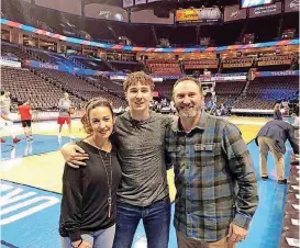  ?? [PHOTO PROVIDED] ?? Emily, Caleb and the Rev. Jeremy Freeman, of Newcastle, pose for a photo before a Oklahoma City Thunder vs. Atlanta Hawks game at the Chesapeake Energy Arena.