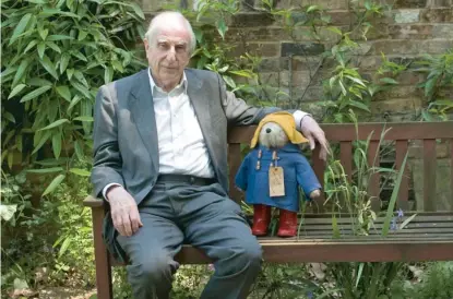  ??  ?? British author Michael Bond sits with a Paddington bear in 2008 in London. | SANG TAN/ AP FILES