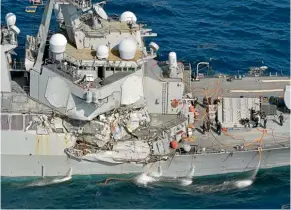  ??  ?? The guided missile destroyer USS Fitzgerald suffered extensive damage to its hull, deck and radar systems in a collision with a merchant ship in Japanese waters.