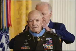  ?? EVAN VUCCI — THE ASSOCIATED PRESS ?? President Joe Biden awards the Medal of Honor to retired Army Col. Paris Davis in the East Room of the White House in Washington on Friday. Davis, a captain and commander with the 5th Special Forces Group, engaged in nearly continuous combat during a pre-dawn raid on a North Vietnamese army camp in the village of Bong Son in Binh Dinh province.