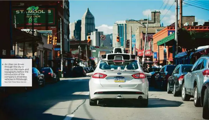  ?? New York Times News Service ?? An Uber car drives through the city to map out the roads and topography before the introducti­on of the company’s driverless vehicles in Pittsburgh.