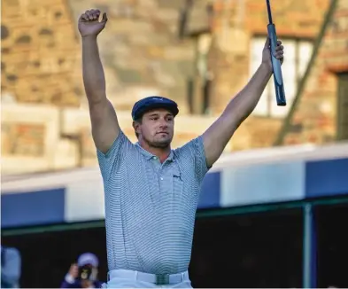  ?? AP ?? Bryson DeChambeau reacts after sinking his final putt Sunday to win the U.S. Open by six shots at Winged Foot.