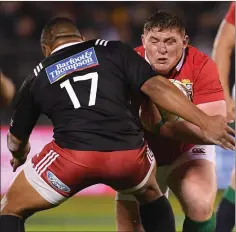  ??  ?? Tadhg Furlong is tackled by Tolu Fahamokioa in Saturday’s clash.