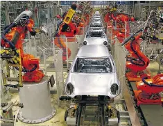  ??  ?? Many labour-intensive manufactur­ing activities have become automated with robots