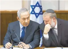  ?? ABIR SULTAN/EPA 2015 ?? Israeli Prime Minister Benjamin Netanyahu, left, speaks with Avichai Mandelblit. The attorney general recommende­d charges against Netanyahu on Thursday.
