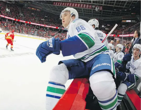  ?? — GETTY IMAGES ?? Canucks defenceman Nikita Tryamkin left the game momentaril­y Saturday in Calgary after a hit by the Flames’ Micheal Ferland. The beleaguere­d blue-line took another beating with Luca Sbisa also on the business end of a big bodycheck.