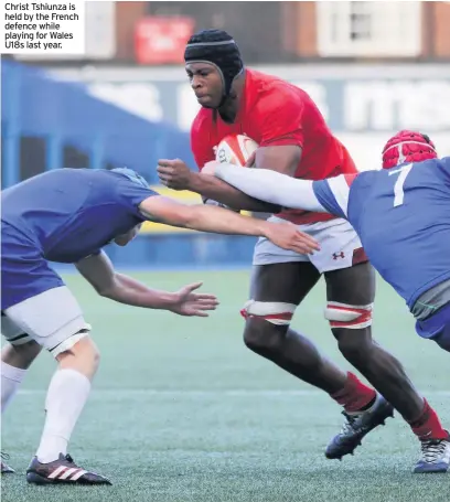  ??  ?? Christ Tshiunza is held by the French defence while playing for Wales U18s last year.