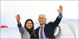  ?? Mandel Ngan AFP/ Getty I mages ?? MIKE PENCE, with wife Karen, is known for his Midwestern nice: seemingly calm and kind, and avoiding conf lict while making others look like idiots.