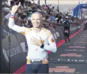  ??  ?? Samuel Etienne a terminé l’Ironman pour la deuxième fois hier, à la tombée de la nuit.