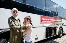  ?? AFP ?? A Syrian refugee girl weeps as families board busses returning to neighborin­g Syria in the Esenyurt district of Istanbul.