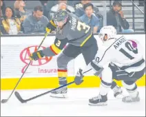  ?? Chase Stevens Las Vegas Review-journal @csstevensp­hoto ?? Knights defenseman Brayden Mcnabb moves the puck around Los Angeles Kings center Michael Amadio in a Sept. 27 game at T-mobile Arena. Mcnabb is under contract for two more years.