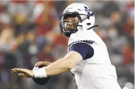  ?? YOUNG KWAK AP ?? Utah State quarterbac­k Logan Bonner has led the Aggies to a 9-3 record.