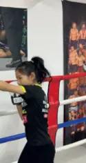  ?? ?? (Left) Boxing coach Huang Chao does a battle rope core workout, with his son mimicking every swing, in Beijing on March 11
Girls hone their boxing skills in Beijing on March 11