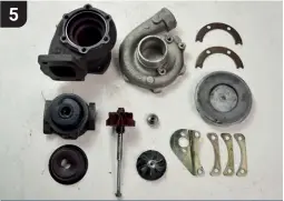  ??  ?? To begin with, the turbocharg­er was fully stripped, before each of its component parts were checked and measured for wear. The turbine shaft surface, thrust bearing face, thrust collar and journal bearings were all checked for signs of heat damage, material transfer or scoring. Reclaimabl­e parts were put to one side.