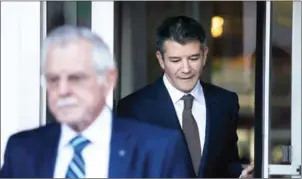  ?? JUSTIN SULLIVAN/GETTY IMAGES/AFP ?? Former Uber CEO Travis Kalanick (right) leaves the Phillip Burton Federal Building on day three of the trial between Waymo and Uber Technologi­es on Wednesday in San Francisco, California.