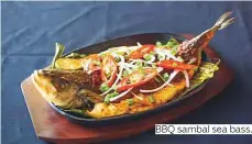  ??  ?? BBQ sambal sea bass.