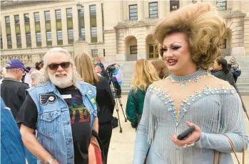  ?? BRUCE SCHREINER/AP ?? Drag performer Poly Tics, right, attends a rally Thursday in Frankfort, Kentucky, to oppose a bill that would put limits on drag shows after speaking earlier during a legislativ­e committee hearing at the state Capitol.