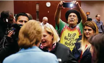  ?? Michael Ciaglo photos / Houston Chronicle ?? Marijuana reform activists, including Carlos Calbillo, center, praised Harris County District Attorney Kim Ogg’s new policy that does not arrest people caught with small amounts of pot.