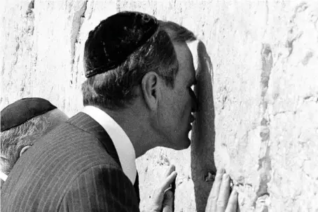  ?? (Reuters) ?? THEN VICE-PRESIDENT George H.W. Bush kisses the Western Wall in Jerusalem in July 1986.