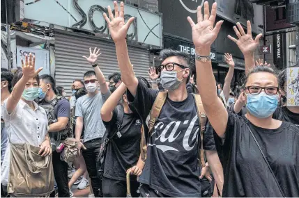  ?? NYT ?? Protesters gather against the new proposed security law in Hong Kong on Sunday.