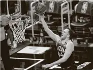  ?? Rick Bowmer / Associated Press ?? Jazz forward Bojan Bogdanovic lays the ball up in the second half on his way to a 32-point game.