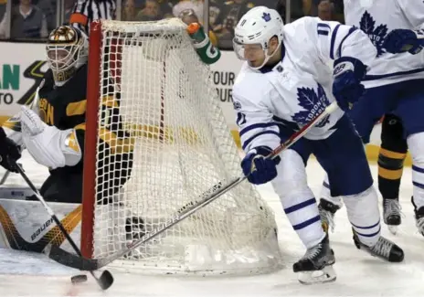  ?? MARY SCHWALM/THE ASSOCIATED PRESS ?? Zach Hyman, denied on a wraparound attempt against Zane McIntyre and the Bruins last February, does the dirty work down low for the Leafs.