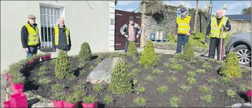  ?? ?? Lismore Tidy Towns members relaxing after planting the circular bed at the North Mall with evergreen flowering pollinator friendly perennials. From left - Michael McBride, Willie Henry, Liam Ahearne, Pat Fleming and Billy Ormonde.