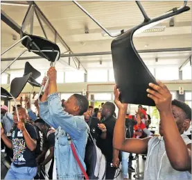  ?? Pictures: PHANDO JIKELO ?? TAKING A STAND: UWC students raised chairs in protests that closed down the university.