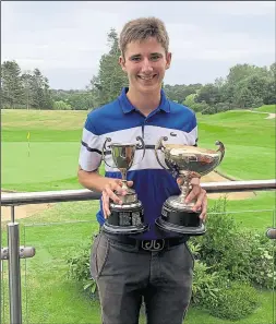  ??  ?? Ashford GC’s James Wright with his trophies