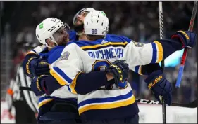  ?? Jack Dempsey The Associated Press ?? The St. Louis Blues celebrate one of their four goals in Game 2 against the Avalanche, tying their West semifinal series at 1-1.