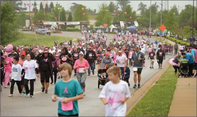  ?? NWA Democrat-Gazette BEN GOFF ?? Runners and walkers start the untimed 5K during last year’s annual Susan G. Komen Ozark Race for the Cure at Pinnacle Hills Promenade Mall in Rogers.