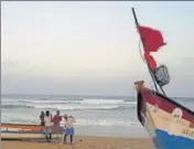  ?? AP ?? Fishermen carry their boat at Marina Beach in Chennai.